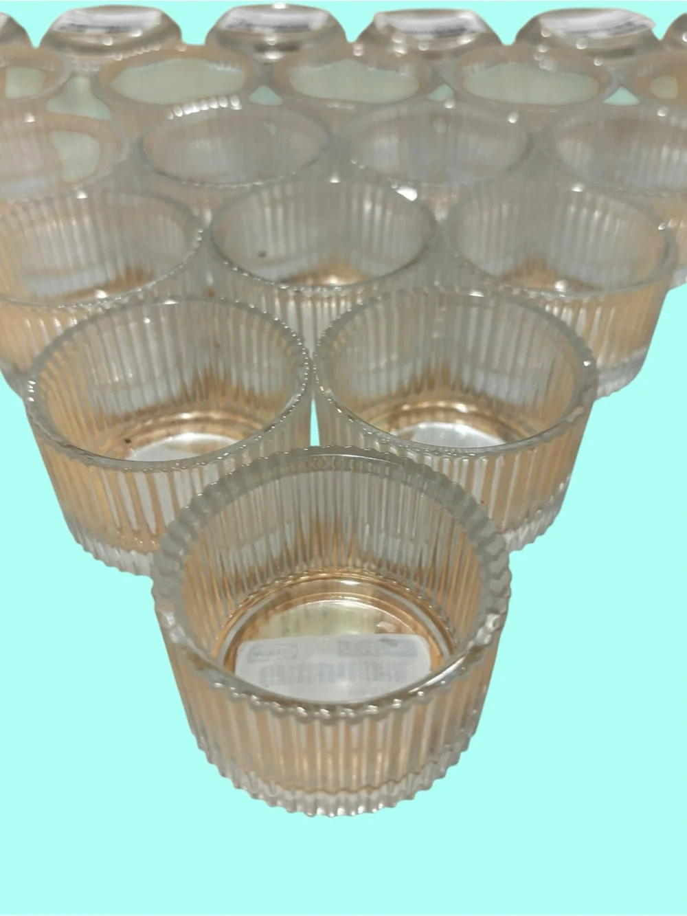 21 IKEA FINSMAK clear glass tealight holders.